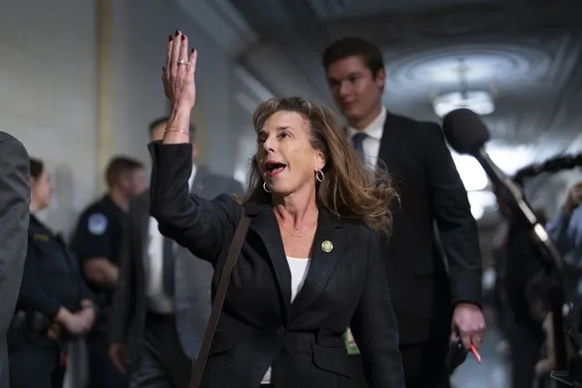 Rep. Lisa McClain, R-Mich., gestures on arrival as House Republicans hold a closed-door forum to hear from the contenders for speaker of the House, at the Capitol in Washington, Tuesday, October 10, 2023. House business and most congressional action has come to a standstill after Rep. Kevin McCarthy, R-Calif., was ousted as speaker by conservatives in his own party. (Photo by J. Scott Applewhite/AP Photo)