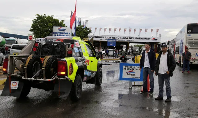 Participants of the Dakar Rally arrive in Puerto Falcon before the beginning of the race, located on the Paraguayan side of the border and linked to the city of Clorinda in Argentina December 28, 2016. (Photo by Jorge Adorno/Reuters)