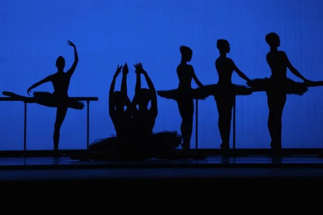 American Ballet Theater's dancers are silhouetted as they rehearse for the opening night at the Shanghai Grand Theater in Shanghai, Thursday, November 2, 2023. The American national ballet company is returning to China for the first time in a decade for shows in Shanghai and Beijing in the latest sign strained relations between the United States and China are beginning to thaw. (Photo by Ng Han Guan/AP Photo)