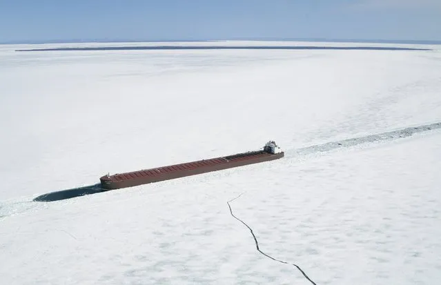 The James R Barker Lake Freighter is shown trapped in ice in this aerial photo near Whitefish Bay on Lake Superior northwest of Sault Ste. Marie, Ontario April 7, 2015. (Photo by Kenneth Armstrong/Reuters)