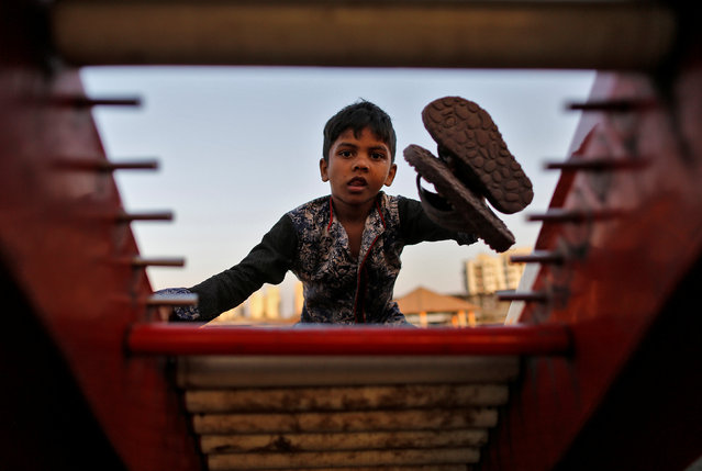 A boy climbs a broken slide at a public park in Dharavi, one of Asia's largest slums in Mumbai, India, January 5, 2017. (Photo by Danish Siddiqui/Reuters)