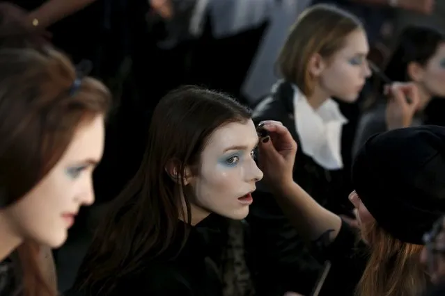 Models are prepared backstage before the Thom Browne Fall/Winter 2016 collection presentation during New York Fashion Week February 15, 2016. (Photo by Andrew Kelly/Reuters)