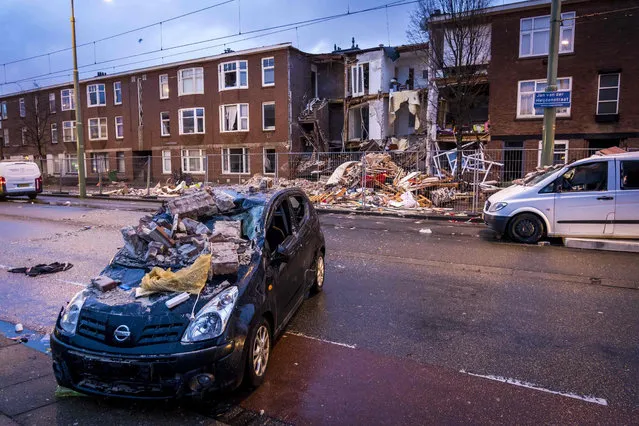 A damaged vehicle is seen in front of a collapsed building, one day after a gas explosion in the Jan van der Heijdenstraat in The Hague, the Netherlands, on January 28, 2019. (Photo by Lex van Lieshout/AFP Photo)