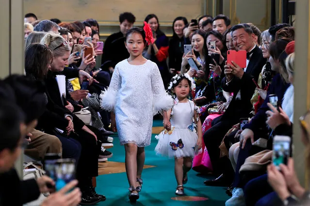Girls present creations by Charabia children's fashion brand during the Kids Fashion Week Paris in Paris, France, February 15, 2019. (Photo by Gonzalo Fuentes/Reuters)