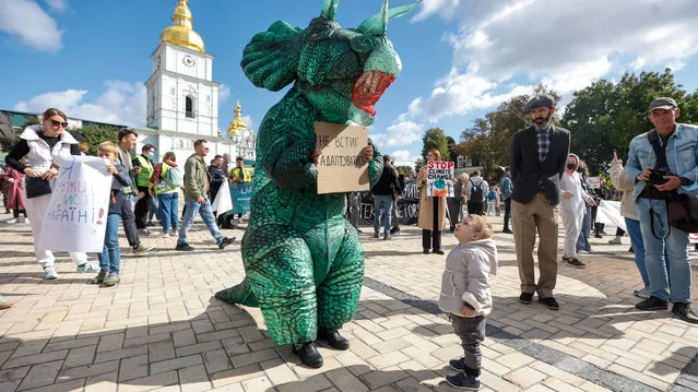 Environmental activists take part in a rally demanding actions to avert climate change in central Kyiv, Ukraine on September 26, 2021. (Photo by Serhii Nuzhnenko/Radio Free Europe/Radio Liberty)