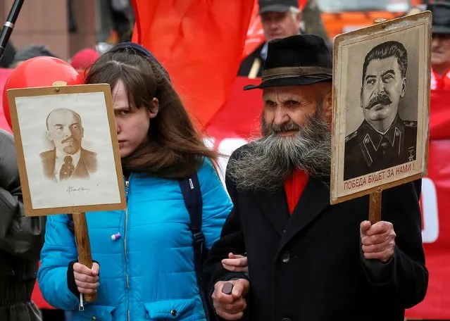 Supporters of the Russian Communist party take part in a May Day rally in Krasnoyarsk, Russia on May 1, 2019. (Photo by Ilya Naymushin/Reuters)