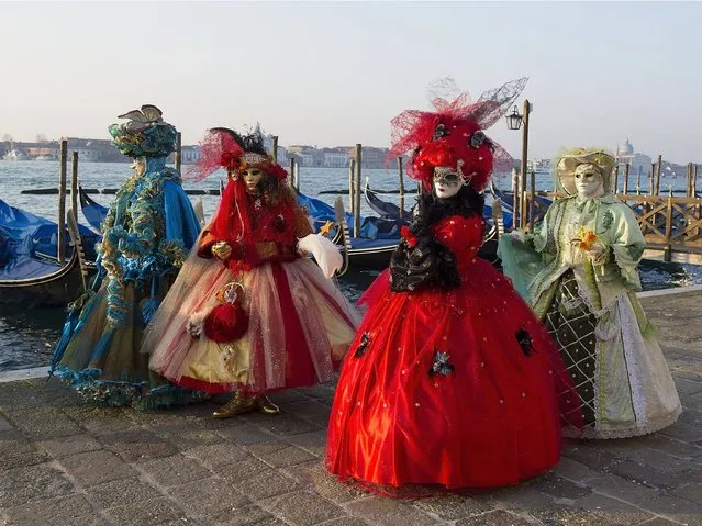 During the Carnival Venice, the most magical of cities fills with a mass of masked participants posing and preening, dancing and philandering, in a slightly surreal re-invention of a great tradition of the city. (Photo by Marco Secchi/Getty Images)