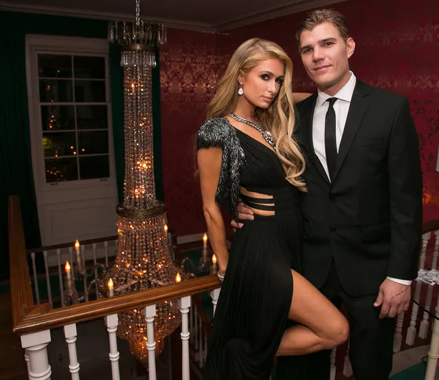Paris Hilton (L) and Chris Zylka attend the Circus Magazine Oscars Celebration Hosted By Steve Shaw and Jonas Tahlin, CEO Absolut Elyx Sponsored by Volvo and Vaseline on February 26, 2017 in Los Angeles, California. (Photo by Gabriel Olsen/WireImage)