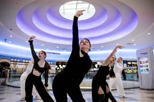 Members of the band GeneSiS dance while they record a one-take cover dance video, in a shopping mall in Moscow, Russia, on January 28, 2024. (Photo by Maxim Shemetov/Reuters)