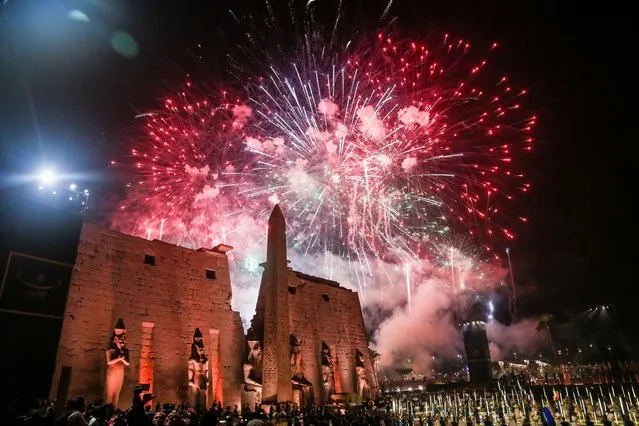 Fireworks light the sky during the official ceremony opening of the Avenue of the Sphinxes on November 25, 2021 in Luxor, Egypt. After years of renovation and in a bid to reinvigorate Egypts tourism sector, the 2,700 meter Avenue of the Sphinxes was reopened in a grand ceremony showcasing Egypts second most visited heritage site after the Giza Pyramids. Egypt has embarked on several major restoration projects to restore historic sites and promote tourism after the coronavirus took a heavy toll on the countries tourism sector. (Photo by Islam Safwat/Getty Images)