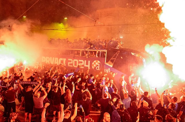 Dinamo Zagreb players parade on a bus' roof as they celebrate winning Croatian first league football championship in Zagreb, on May 27, 2024. (Photo by Damir Sencar/AFP Photo)