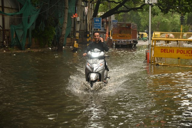 Vehicles wades through water logged rain in New Delhi, India on 28 June , 2024. (Photo by Deep Nair/ZUMA Press Wire/Alamy Live News)