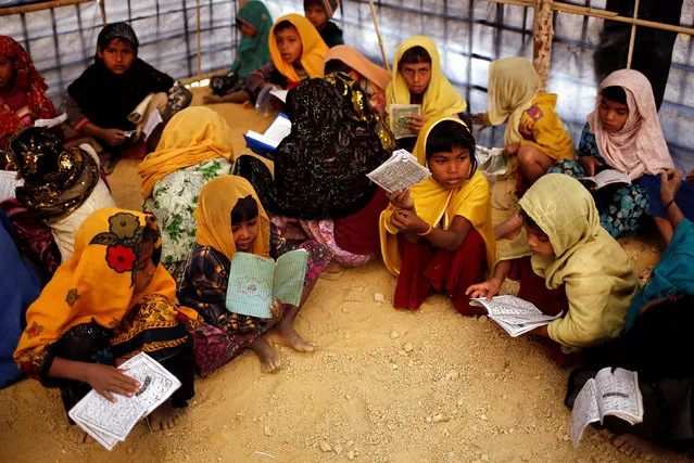 Rohingya refugee children attend an Arabic school to learn to recite the Koran at Kutupalang Makeshift Refugee Camp in Cox’s Bazar, Bangladesh, February 12, 2017. (Photo by Mohammad Ponir Hossain/Reuters)