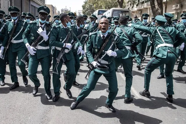 Military Personnel sing and dance during celebrations for Independence Day in Dakar on April 4, 2022. Senegal Celebrates its sixty second Independence Day after gaining independence from France in 1960. (Photo by John Wessels/AFP Photo)