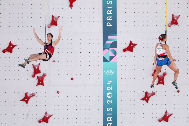 Zhou Yafei of Team People’s Republic of China celebrates as Beatrice Colli of Team Italy looks dejected during the Women's Speed Climbing - Seeding Heats on day ten of the Olympic Games Paris 2024 at Le Bourget Sport Climbing Venue on August 05, 2024 in Paris, France. (Photo by Julian Finney/Getty Images)