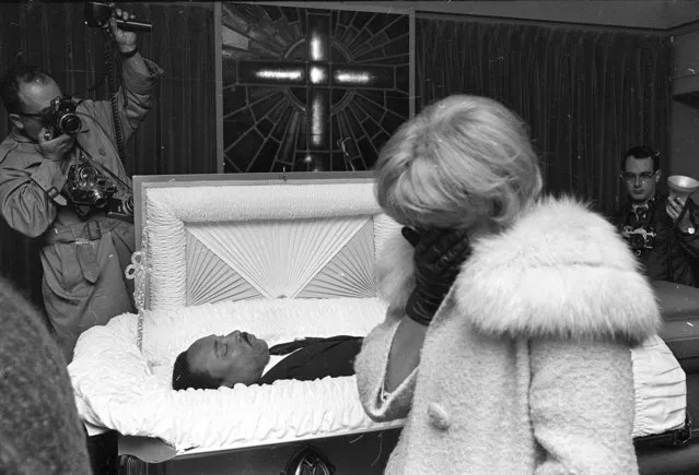 An unidentified woman weeps at the R.S. Lewis funeral home in Memphis, Tenn., as hundreds of mourners filed past the body of civil rights leader Dr. Martin Luther King, Jr., April 5, 1968, before it was to be sent to Atlanta for burial. (Photo by Charles Kelly/AP Photo)