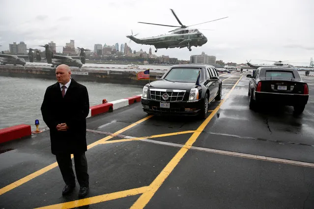 A Secret Service agent stands watch as U.S. President Barack Obama arrives aboard the Marine One helicopter at the Downtown Manhattan Heliport in New York, U.S. June 8, 2016. (Photo by Jonathan Ernst/Reuters)