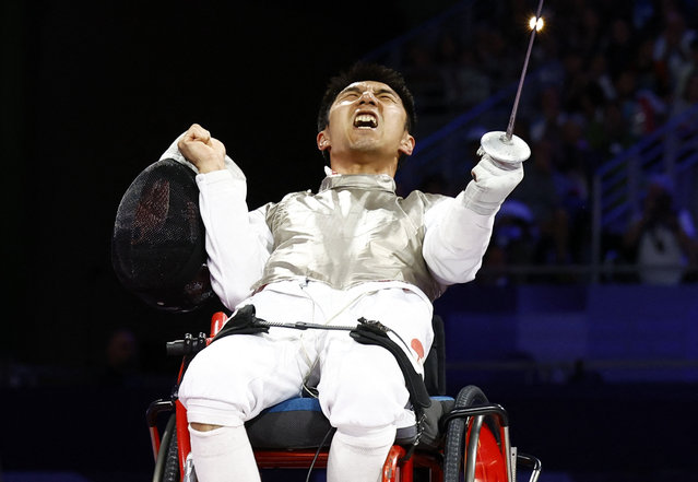 Sun Gang of China celebrates after winning gold against Matteo Betti of Italy during the men's wheelchair fencing foil category A bout in Paris, France on September 4, 2024. (Photo by Carlos Garcia Rawlins/Reuters)