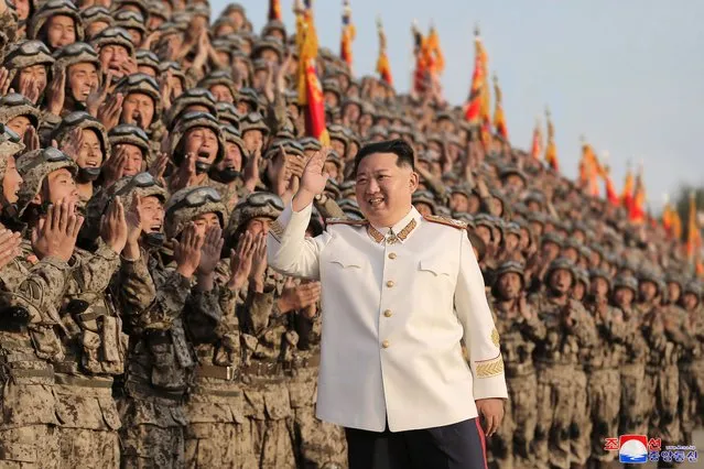 A photo released by the official North Korean Central News Agency (KCNA) shows North Korean Supreme Leader Kim Jong-Un wearing a white marshal uniform, during a photo session with the officers and soldiers that took part in a military parade, in Pyongyang, North Korea, 27 April 2022 (issued 29 April 2022). The soldiers participated in a military parade in Pyongyang on April 25 to mark the 90th anniversary of the Korean People's Revolutionary Army. (Photo by KCNA/EPA/EFE)