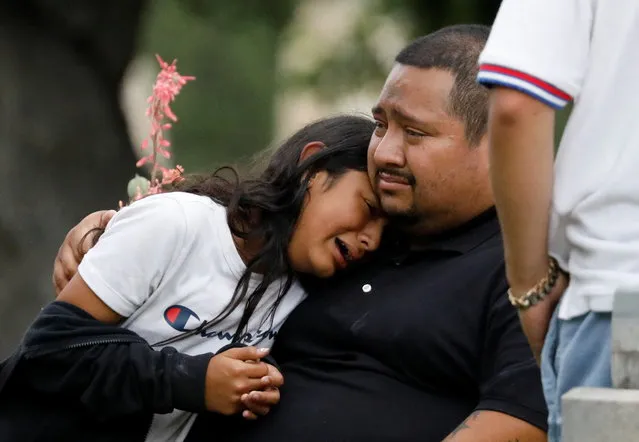 People react outside the Ssgt Willie de Leon Civic Center, where students had been transported from Robb Elementary School after a shooting, in Uvalde, Texas, U.S. May 24, 2022. (Photo by Marco Bello/Reuters)