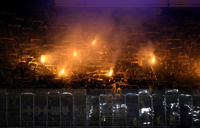 Young Boys' supporters cheer with flares during the UEFA Champions League, league phase day 2 football match between FC Barcelona and Young Boys at the Estadi Olimpic Lluis Companys in Barcelona on October 1, 2024. (Photo by Josep Lago/AFP Photo)