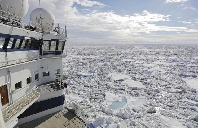 The Finnish icebreaker MSV Nordica sails through sea ice floating on the Victoria Strait while traversing the Arctic's Northwest Passage, Friday, July 21, 2017. The AP is accompanying a group of international researchers is sailing into the Arctic Sea aboard the Finnish icebreaker to traverse the Northwest Passage and record the environmental and social changes that are taking place in one of the most forbidding corners of the world. (Photo by David Goldman/AP Photo)