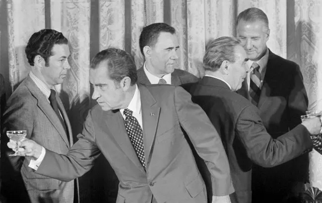 President Richard Nixon and Soviet leader Leonid I. Brezhnev are shown after drinking a toast after signing a nuclear agreement at the White House in Washington, June 22, 1973. (Photo by AP Photo)