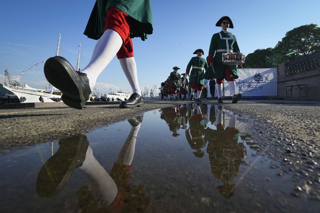 Musicians wearing 18th century suits walk during festivities marking 350th birthday of Russian Tsar Peter the Great in St. Petersburg, Russia, Thursday, June 9, 2022. (Photo by Dmitri Lovetsky/AP Photo)