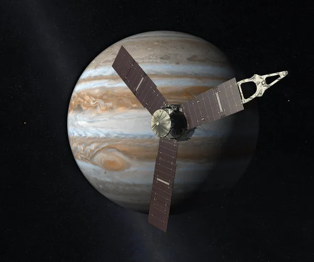 This artist's rendering provided by NASA and JPL-Caltech shows the Juno spacecraft above the planet Jupiter. Five years after its launch from Earth, Juno is scheduled to go into orbit around the gas giant on Monday, July 4, 2016. (Photo by NASA/JPL-Caltech via AP Photo)