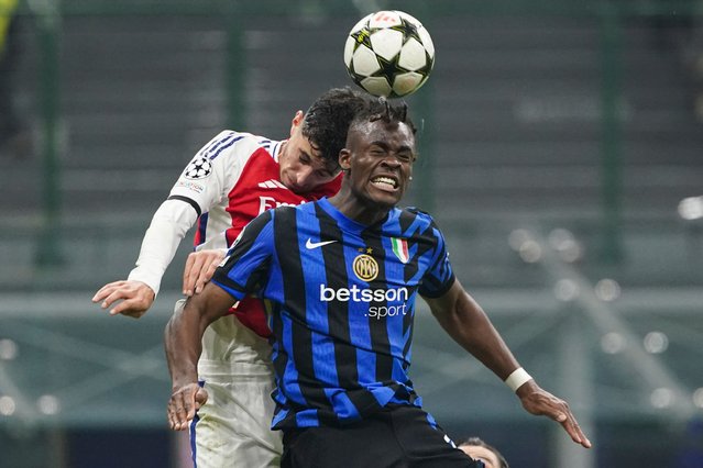 Kai Havertz of Arsenal and Yann Aurel Bisseck of Inter Milan battle for the ball during the Champions League match between Inter Milan and Arsenal at San Siro Stadium in Milan, Italy, on November 6, 2024. (Photo by RemotePhotoPress/Rex Features/Shutterstock)