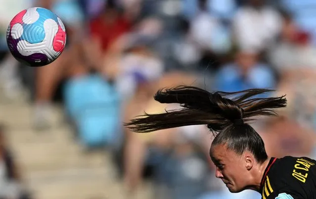 Belgium's striker Tine De Caigny headers the ball during the UEFA Women's Euro 2022 Group D football match between Belgium and Iceland at Manchester City Academy Stadium in Manchester, north-west England on July 10, 2022. (Photo by Daniel Mihailescu/AFP Photo)