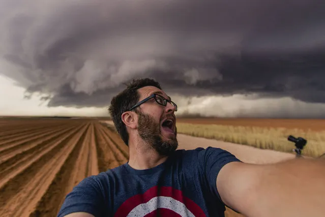 While most people head for cover at the first sign of a storm, this man runs straight toward it. Storm chaser and father of three Mike Olbinski is addicted to photographing extreme weather and regularly takes on tornadoes and supercell thunderstorms in a bid to capture extraordinary images. The photographer, from Phoenix, often travels hundreds of miles a day to reach the eye of a storm. He first became hooked on the unusual hobby almost a decade ago, following the birth of his daughter. Here: Mike, the photographer on May 31, 2016. (Photo by Mike Olbinski/Caters News Agency)