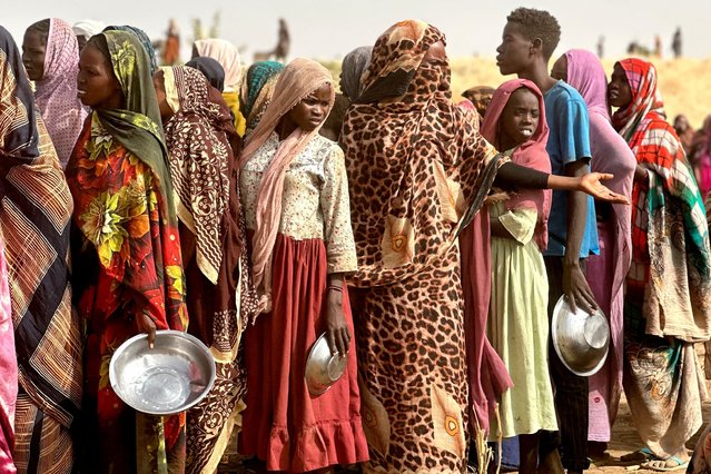 People who fled the Zamzam camp for the internally displaced after it fell under RSF control, queue for food rations in a makeshift encampment in an open field near the town of Tawila in war-torn Sudan's western Darfur region on April 13, 2025. Sudan's paramilitary Rapid Support Forces (RSF) announced on April 13 that it had taken control of the famine-hit Zamzam camp, home to over 500,000 refugees according to the United Nations, after two days of heavy shelling and gunfire, amid its ongoing war with the country's army and affiliated forces. (Photo by AFP Photo/Stringer)