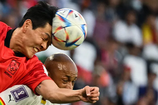 South Korea's defender #19 Kim Young-gwon (L) and Ghana's midfielder #10 Andre Ayew fight for the ball during the Qatar 2022 World Cup Group H football match between South Korea and Ghana at the Education City Stadium in Al-Rayyan, west of Doha, on November 28, 2022. (Photo by Jung Yeon-Je/AFP Photo)