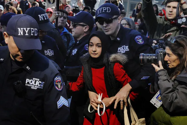 New York Police Department officers arrest a woman who was taking part in a “Day Without a Woman” march on International Women's Day in New York, March 8, 2017. (Photo by Lucas Jackson/Reuters)