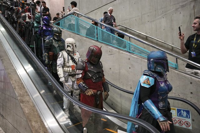 Star Wars fans in different creations of the Boba Fett uniforms attend a fan convention, the Star Wars Celebration in Chiba, near Tokyo, Friday, April 18, 2025. (Photo by Hiro Komae/AP Photo)