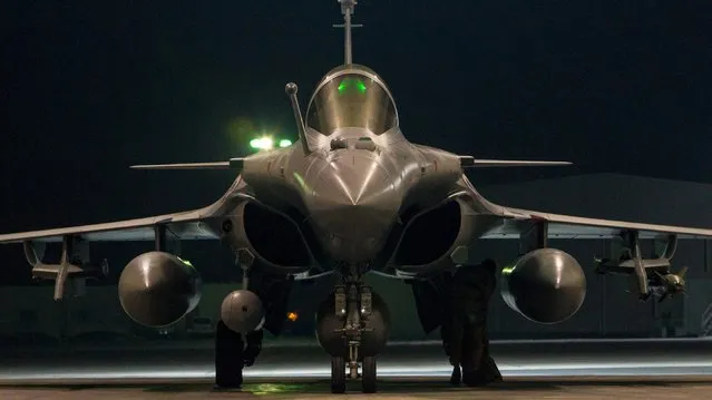 A French airforce Rafale fighter jet, in a picture released October 9, 2015 by the French Defense Audiovisual Communication and Production Unit (ECPAD), prepares to take off at from base in an unidentified location, to strike targets in and around Raqqa, Syria. France launched a new air strike overnight in Syria against an Islamic State training camp France's Defence Minister said on Friday. (Photo by Reuters/ECPAD)