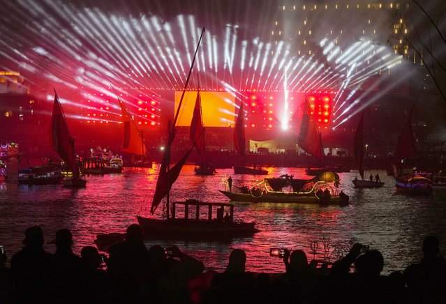 People take boat tours on the Nile River past New Year decorations as celebrations begin in Cairo, Egypt, Sunday, January 1, 2023. (Photo by Amr Nabil/AP Photo)