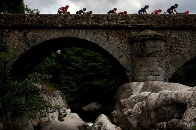 The pack of riders in action during the 14th stage of the 105th edition of the Tour de France cycling race over 188km between Saint-Paul-Trois-Chateaux and Mende, France, 21 July 2018. (Photo by Kim Ludbrook/EPA/EFE/Rex Features/Shutterstock)