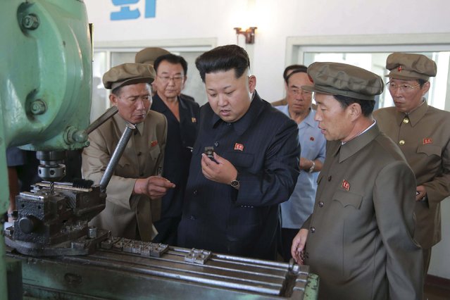 North Korean leader Kim Jong Un (C) visits the Sinuiju Measuring Instrument Factory in this undated photo released by North Korea's Korean Central News Agency (KCNA) in Pyongyang September 4, 2015. (Photo by Reuters/KCNA)