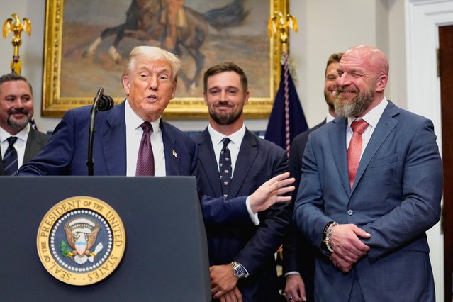U.S. President Donald Trump and WWE Chief Content Officer Paul Michael Levesque, also known professionally as Triple H, react as Trump delivers remarks at the White House in Washington, D.C., U.S., July 31, 2025. (Photo by Kent Nishimura/Reuters)