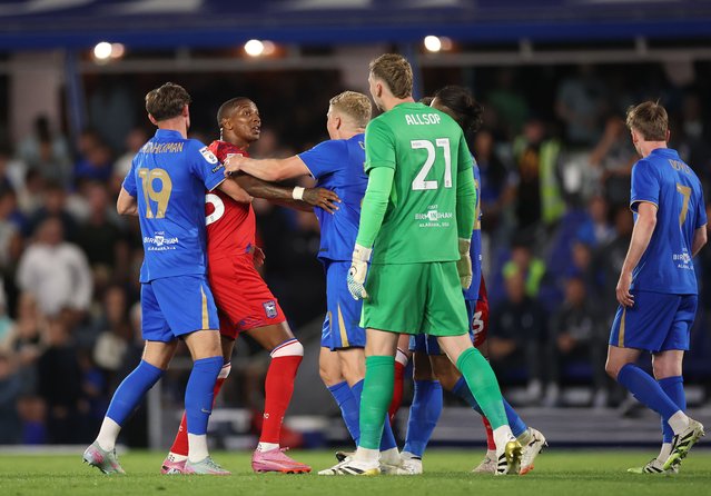 Ashley Young of Ipswich Town is held back by team mates Taylor Gardner-Hickman and Alex Cochrane as he clashes with Ryan Allsop of Birmingham City during the Sky Bet Championship match between Birmingham City and Ipswich Town at St Andrew's at Knighthead Park on August 08, 2025 in Birmingham, England. (Photo by Carl Recine/Getty Images)