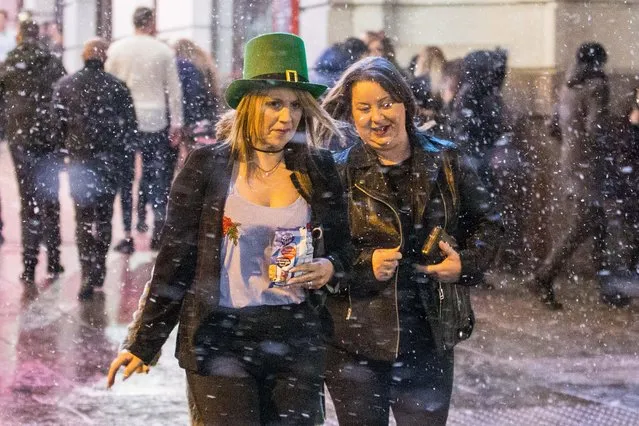 Partygoers celebrate the annual St. Patrick's Day on Saturday, March 17, 2018 in Manchester, England. (Photo by Mercury Press/The Sun)