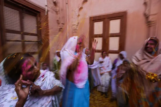 Women and widows take part in Holi celebrations in the town of Vrindavan in the northern state of Uttar Pradesh, India on March 6, 2023. (Photo by Anushree Fadnavis/Reuters)