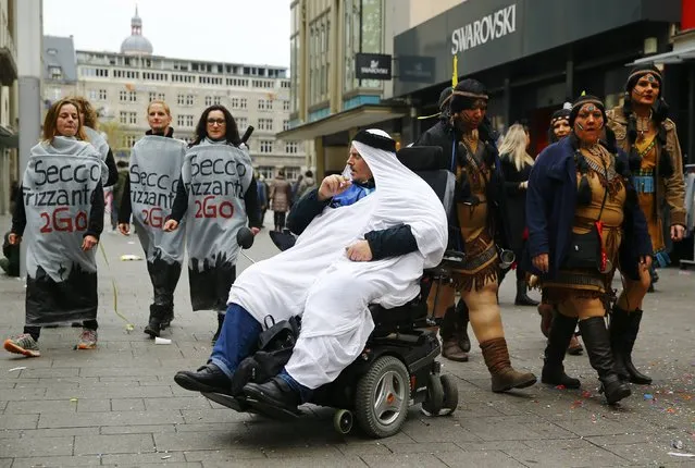 Carnival revellers attend celebrations marking the start of the carnival season in Cologne November 11, 2015. (Photo by Wolfgang Rattay/Reuters)