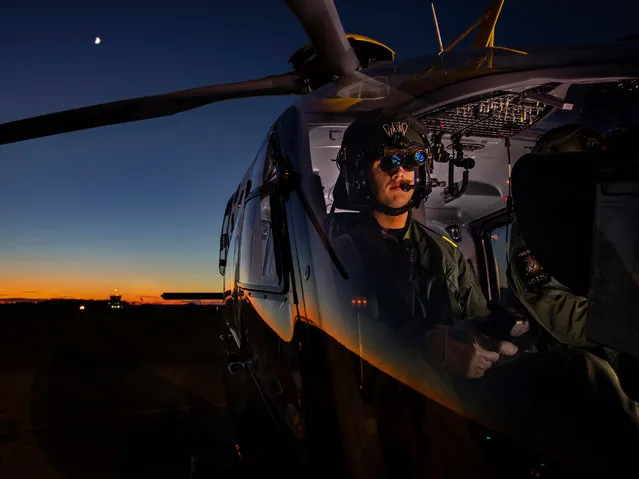 Personnel, 1st place. A student from No 1 flying training school at RAF Shawbury prepares a flight using night-vision goggles. (Photo by Mr Ian Forshaw/2020 RAF Photo Competition)