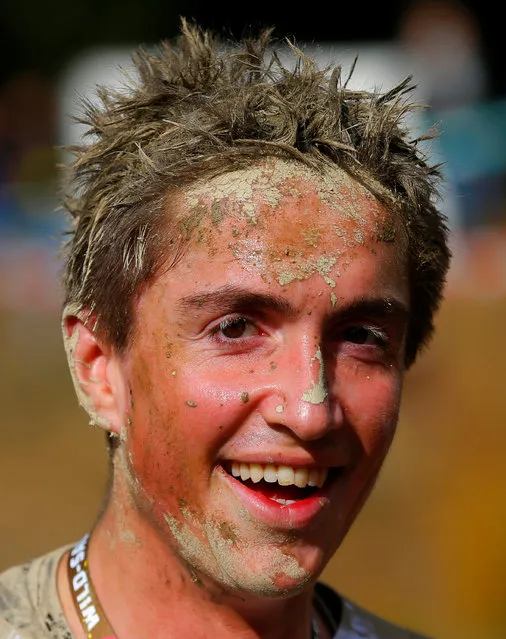A competitors is seen after finishing the Wildsau Dirt Run (Wild Boar Dirt Run) obstacle course fun race at Hellsklamm ravine in Obertriesting, Austria, October 22, 2016. (Photo by Heinz-Peter Bader/Reuters)