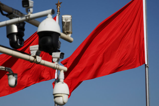 Red flags flutter near surveillance cameras on Tiananmen Square before a ceremony to mark Martyrs' Day, a day ahead of the National Day in Beijing, China on September 30, 2025. (Photo by Florence Lo/Reuters)