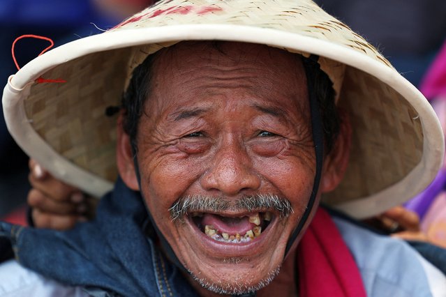 A farmer reacts while taking part in a rally marking National Farmers' Day, demanding agrarian reform and protesting land reduction, according to a farmers' association that says it was taken over by the government and other state bodies, outside the parliament building in Jakarta, Indonesia, on September 24, 2025. (Photo by Willy Kurniawan/Reuters)