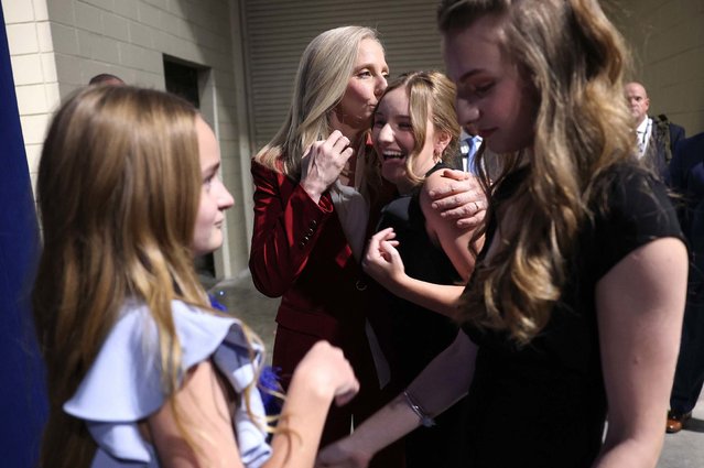 Abigail Spanberger embraces her daughter Charlotte near her other daughters, Claire and Catherine, at an election-night rally in Richmond, Virginia, on Tuesday, November 4, 2025. Spanberger, a former Democratic congresswoman and CIA officer, has been elected Virginia’s next governor. She will become the state’s first female chief executive. (Photo by Win McNamee/Getty Images)